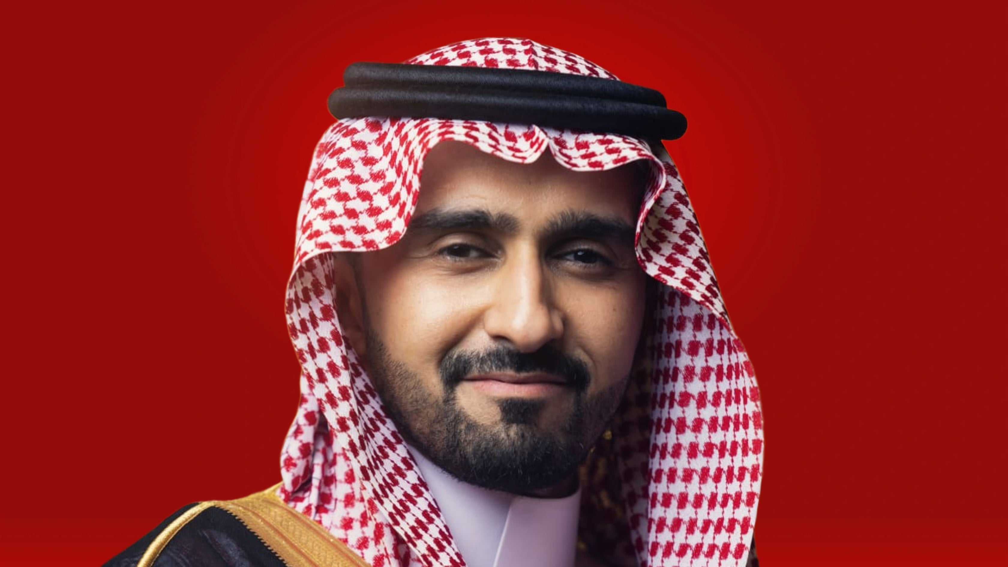 Man in traditional red and white keffiyeh against red background