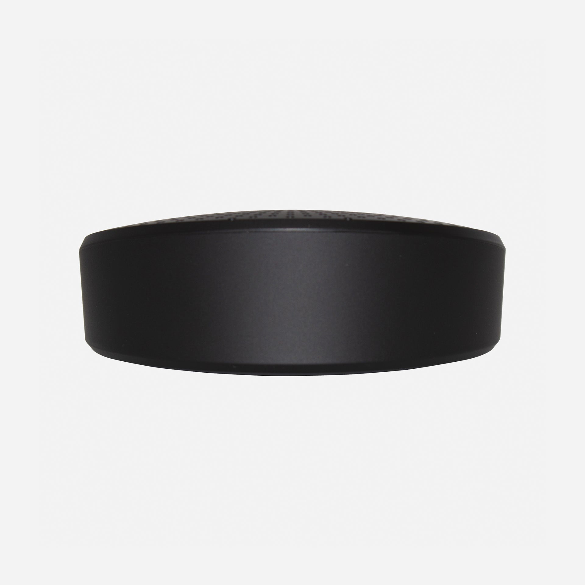 A black portable conference speaker with a built-in microphone and echo cancellation algorithm