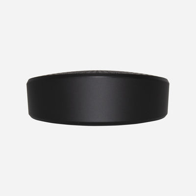 A black portable conference speaker with a built-in microphone and echo cancellation algorithm